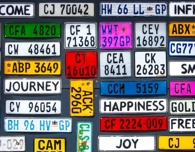 Various license plates with numbers and words.