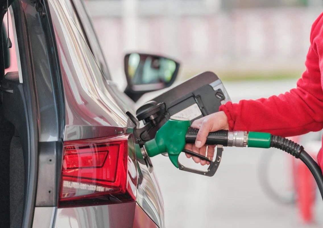 A person refueling their car.