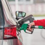 A person refueling their car.