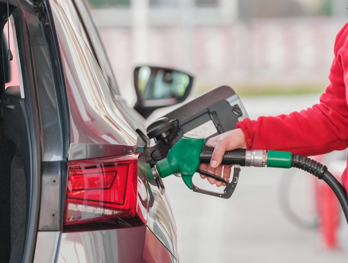 A person refueling their car.